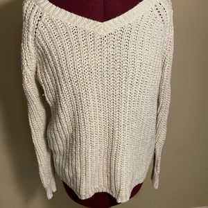 White sweater with silver details